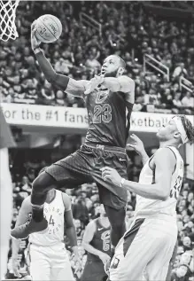  ?? TONY DEJAK
THE ASSOCIATED PRESS ?? Cleveland Cavaliers’ LeBron James (23) drives to the basket against Indiana Pacers’ Myles Turner in the first half. Cleveland won, 105-101.