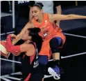  ?? CHRIS O'MEARA/AP ?? Las Vegas Aces guard Kayla McBride (21) has her shot blocked by Phoenix Mercury guard Diana Taurasi Sept. 1, 2020, in Bradenton, Fla.