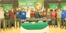  ?? KEITH GROLLER/THE MORNING CALL ?? On Wednesday at Rockne Hall, 14 Allentown Central Catholic student-athletes committed to colleges to continue their athletic careers. They were, from left, Cole Sonday, Ben Scandone, Mason Abromitis, Chuck Kuczynski, Jen Milisits, Sammy Jo Mikosky, Riley Horoshko, Caleigh Nelson, Samantha Fanger, Julia Roth, Carly Rohrbach, Jack Keenan, Aiden Carroll and Liam Drake.