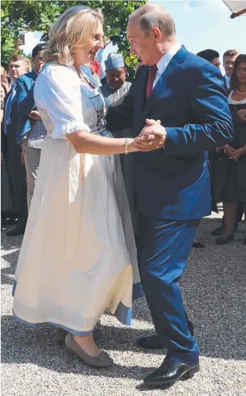  ?? Picture: AFP ?? Austrian Foreign Minister Karin Kneissl and Russian President Vladimir Putin dance during her wedding.