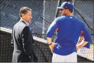  ?? Julie Jacobson / Associated Press ?? Mets chief operating officer Jeff Wilpon, left, talks with manager Mickey Callaway.