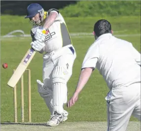  ?? Picture: Chris Davey FM4775398 ?? Faversham’s Danny Haxton is beaten by a ball from Rodmersham’s Adam Rayner on Saturday