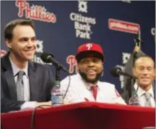  ?? JOSE F. MORENO — THE PHILADELPH­IA INQUIRER VIA AP ?? Phillies general manager Matt Klentak, left, newly signed first baseman Carlos Santana, center, and manager Gabe Kapler, share a laugh during a press conference on Wednesday.