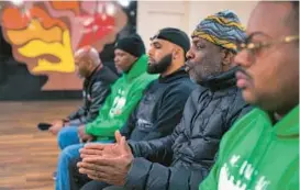  ?? KARL MERTON FERRON/STAFF ?? Richard Lewis, talking, sits with, Gregory Gee, from left, James Gaymon III, Clarence Young Jr. and Brandon Wilson during an interview at Langston Hughes Community Center with life coaches participat­ing in the Maryland Department of Juvenile Services’ Thrive Academy program, which provides support services to youths at the highest risk of gun violence.