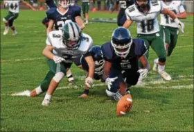  ?? AUSTIN HERTZOG - DIGITAL FIRST MEDIA ?? Pottstown’s Adrian Sibilly (5) makes a fumble recovery on a kickoff just in front of Bishop Shanahan’s Connor Whelan Friday.