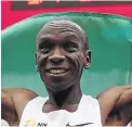  ?? / REUTERS ?? Eliud Kipchoge savours the moment after becoming the first man to run the marathon under two hours.