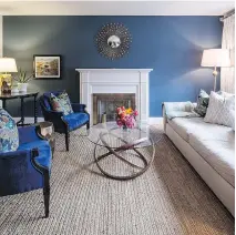  ??  ?? Painting a room or just a wall in a deep colour like this gorgeous navy (Farrow and Ball’s Stiffkey Blue), is a great way to cosy up a room, designer Emma Doucet says.