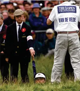  ?? AP FILE ?? Jean Van de Velde (bottom center) stands in Barry Burn on the 18th hole with water up his shins. He made triple bogey to lose a three-shot lead in 1999 at Carnoustie.