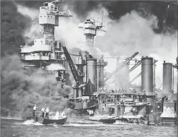  ??  ?? This rp kavy file image shows a ship burning after the gapanese attack on mearl earbor on aec TI 1941.