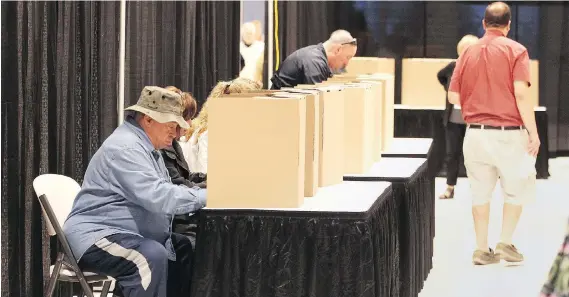  ?? NICK BRANCACCIO ?? Voters at the city’s Devonshire Mall cast their ballots at advance polling stations on Saturday morning. A total of 1,525 residents made their choices early.