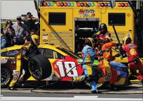  ?? AP PHOTO/MATT SLOCUM ?? The pit crew for Kyle Busch services the car in a stop during a NASCAR Cup Series auto race at Pocono Raceway, Sunday, July 24, 2022 in Long Pond, Pa.