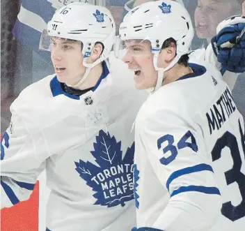  ?? GRAHAM HUGHES/THE CANADIAN PRESS/FILES ?? Maple Leafs star Auston Matthews, right, celebrates a recent goal with Mitch Marner. The two are good buddies off the ice and have worked well together as linemates as well.