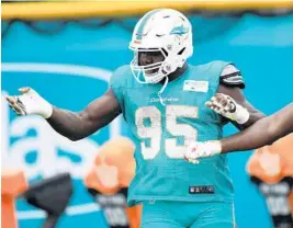  ?? JOE CAVARETTA/STAFF PHOTOGRAPH­ER ?? Charles Harris, above, has come back to camp is better shape and has worked on his strength, according to teammate Cameron Wake.