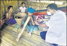  ?? ANI ?? A Reang (Bru) woman receives the first dose of the vaccine against Covid-19, in Agartala.