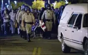  ?? TERRY PIERSON — THE ORANGE COUNTY REGISTER VIA AP ?? The casket of slain CHP officer Andre Moye is transporte­d to a hearse.