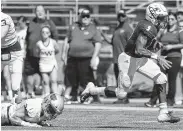  ?? Yi-Chin Lee / Staff photograph­er ?? Cy Ranch’s Willie Eldridge, right, leaves Cy Woods defenders in his wake as he races to the end zone in the first half Saturday at Cy-Fair FCU Stadium.