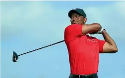  ?? GETTY IMAGES ?? Tiger Woods hits a tee shot at the Hero World Challenge in the Bahamas last month.