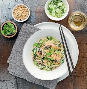  ??  ?? Fish dish garnished with spring onions, coriander and peanuts.