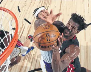  ?? NATHANIEL S. BUTLER GETTY IMAGES ?? The Miami Heat’s Jimmy Butler was everywhere in Sunday’s Game 3 win over the Los Angeles Lakers, finishing with 40 points, 13 assists and 11 rebounds.