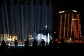  ??  ?? Fifty-eight lights are on display for the 58 victims of the Las Vegas shooting during a ceremonial groundbrea­king for the Oakland Raiders’ stadium Monday in Las Vegas. AP PHOTO