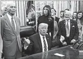  ?? OLIVIER DOULIERY/ABACA PRESS ?? President Trump speaks about the 50th anniversar­y of the moon landing during an Oval Office meeting with Apollo 11 astronauts Michael Collins, left, and Buzz Aldrin, right.