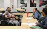  ?? ?? Torry Brown (left), a self-advocate, co-taught two workshops to Public Health – Dayton & Montgomery County staff titled “Improving Service Outcomes for People with Developmen­tal Disabiliti­es.” Here he speaks with Dominique Ayres, Disease Interventi­on Specialist. Torry is a member of DDS’s Voices Matter Self-Advocacy group, and has presented on disability­related topics on many occasions to groups ranging from law enforcemen­t personnel to students.