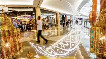  ??  ?? GOLDEN GLOW ... Malls across Dubai reflect the cheer of the festive season. At Burjuman, golden colours dominate Eid decoration­s.