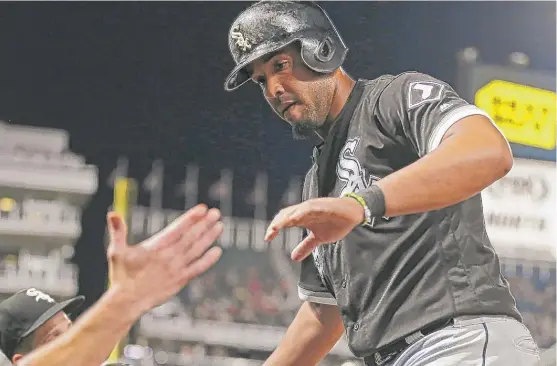  ?? | JIM MONE/ AP ?? White Sox first baseman Jose Abreu returns to the dugout after scoring in the sixth inning on Avisail Garcia’s double Tuesday night against the Minnesota Twins.