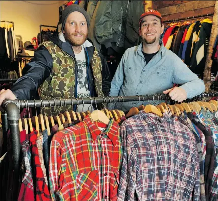  ??  ?? Brothers Drew, left, and Jesse Heifetz show off some of the plaid shirts and repurposed clothes at their vintage store, F is for Frank, in Vancouver. Their father was also in the business.
WAYNE LEIDENFROS­T/PNG