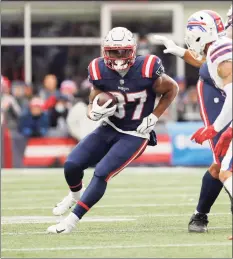  ?? Winslow Townson / Associated Press ?? The New England Patriots’ Damien Harris runs against the Buffalo Bills on Dec. 26.