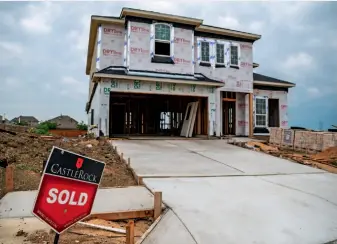  ??  ?? A house is under constructi­on in a housing developmen­t, Texas, US, May