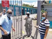  ?? DANICA COTO/ASSOCIATED PRESS ?? An official turns away two voters at a voting center in Carolina, Puerto Rico, Sunday. Puerto Rico’s primaries were marred by a lack of ballots.