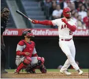  ?? ASHLEY LANDIS – THE ASSOCIATED PRESS ?? The Angels’ Jared Walsh hits a solo home run during the fourth inning against the Nationals on Saturday night.