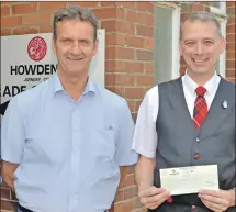  ?? 25_c30howdens­01 ?? Detachment commander Alistair Kenny, right, collects the cheque from Howdens manager Archie Martin.