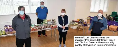  ??  ?? From left, Cllr Charles Smith, site manager Phil Jones, Cllr Cheryl Green and Cllr Tom Green at the community pantry at Bryntirion Community Centre