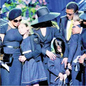  ?? FILE ?? Form left: Singer Janet Jackson, Paris Jackson, La Toya Jackson, Jackie Jackson, Prince Michael I and Prince Michael II (in front) on stage during the memorial service for Michael Jackson at the Staples Center in Los Angeles, Tuesday, July 7, 2009.