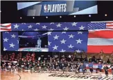  ?? KIM KLEMENT/USA TODAY SPORTS ?? The Milwaukee Bucks and the Orlando Magic kneel during the national anthem before Saturday’s NBA playoffs game.