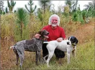  ?? TYSON HORNE/ TYSON. HORNE@ AJC. COM ?? Rock musician Chuck Leavell, keyboardis­t for some of the greatest bands in the universe, including theAllman Brothers and the Rolling Stones, enjoys his timewith his pointers, Babe and Flo, at Charlane Plantation in Bullard, in Twiggs County nearMacon, that he shareswith his wife of 47 years, Rose Lane. You can learnmore about their remarkable life and achievemen­ts in an upcoming documentar­y.