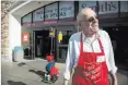  ?? Caroline Brehman Las Vegas Review-Journal ?? James Liebmann accepts donations for the Salvation Army in front of a Smith’s store in late November.