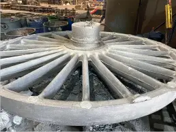  ?? (Peter Morris/trefoil Steel) ?? The first of the new driving wheels is seen on the burning table at Trefoil Steel, Sheffield, for the removal of excess steel.