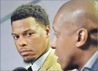  ?? CP PHOTO ?? Raptors point guard Kyle Lowry, left, looks as Raptors president Masai Ujiri speaks during a news conference in Toronto on Friday, July 7, 2017.