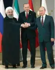  ?? Foto: Tolga Bozoglu, dpa ?? Hand in Hand in Ankara: Ruhani, Erdo gan und Putin.