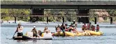  ?? RICH PEDRONCELL­I/AP ?? Rafters hit the cool waters of the American River on May 9 in Rancho Cordova, California.