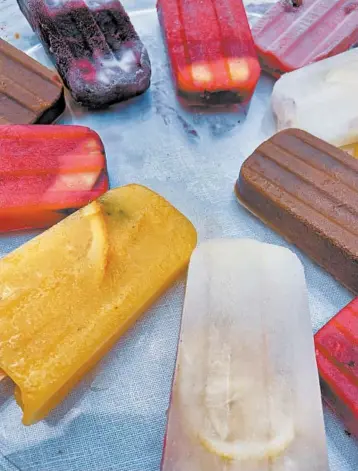  ?? JAMILA ROBINSON/THE PHILADELPH­IA INQUIRER PHOTOS ?? This ice pop recipe can be adapted for any fruit you have on hand. You can also add lime or coconut. For pretty pops, drop thin slices of lemon and lime into the mold before adding liquid.