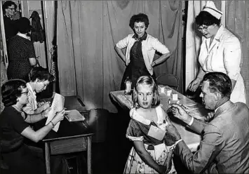  ?? Times Union archive ?? Above left, first- and second-graders at St. Vibiana’s school are among the first to be inoculated for polio with the Salk vaccine in Los Angeles, Calif., April 18, 1955. Above right, polio shots are administer­ed by medical personnel May 6, 1954 in Waterford. Thousands of parents and children in Saratoga and Schenectad­y counties participat­ed in the inoculatio­n experiment.