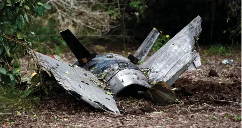  ?? (Ronen Zvulun/Reuters) ?? FRAGMENTS OF a Syrian anti-aircraft missile found in the village of Alonei Abba, about 3.2 km. from where the remains of a crashed F-16 Israeli war plane were found on February 10.