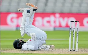  ?? Picture: GETTY IMAGES ?? BOWLED OVER: Azhar Ali of Pakistan falls after getting out the way of a Jofra Archer bouncer during day three of the first #RaiseTheBa­t Test at Emirates Old Trafford in Manchester, England.