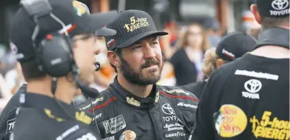  ??  ?? Martin Truex Jr. watches times at qualificat­ions for a NASCAR Cup Series auto race Aug. 10 at Michigan Internatio­nal Speedway in Brooklyn, Mich. Truex begins his quest to repeat as NASCAR’s champion at the playoff opener this weekend in Vegas.
