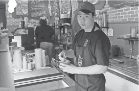  ?? STEVE LEBLANC/AP ?? Christophe­r Au, 19, who has worked at J.P. Licks in Boston for the past few months, said having a job helps him be more independen­t and not to have to rely on his parents too much for spending money.
