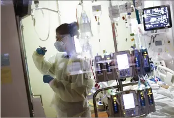  ?? KYLE GREEN — THE ASSOCIATED PRESS FILE ?? Nurse Ann Enderle attends to a COVID-19patient in the intensive care unit at St. Luke’s Boise Medical Center in Boise, Idaho.